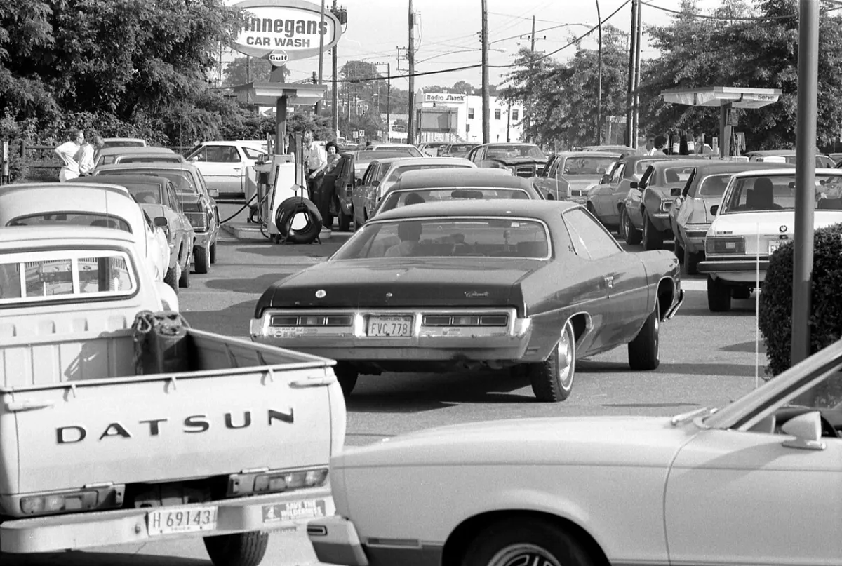 A long line of cars waits to fill up at a gas station, in June 1979