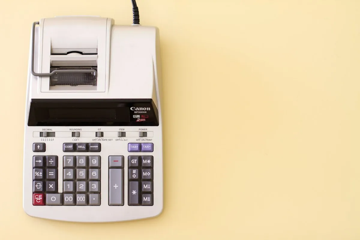 A printing calculator on a yellow background